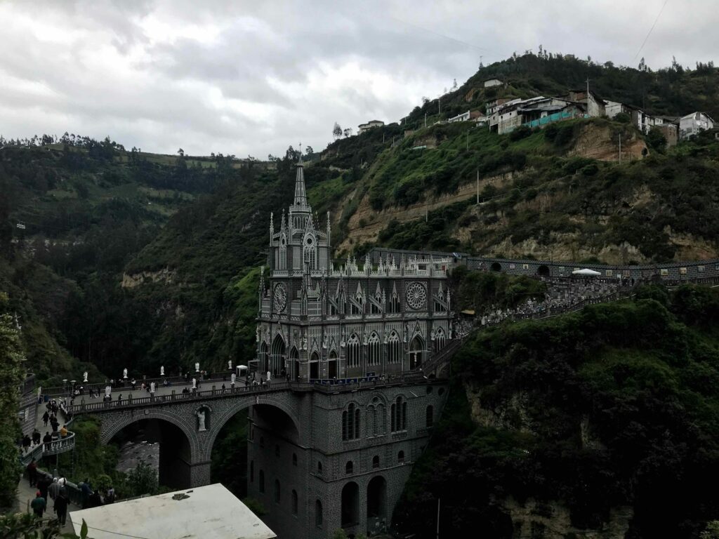 white concrete bridge over the river